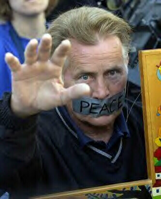 Martin Sheen prays